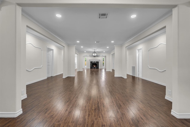 15905 Lakeview Dr, Jersey Village, TX 77040 - unfurnished living room featuring dark wood-type flooring, crown molding, recessed lighting, and a fireplace