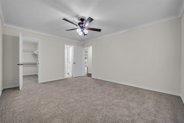 15905 Lakeview Dr, Jersey Village, TX 77040 - unfurnished bedroom featuring carpet flooring, ornamental molding, a spacious closet, a closet, and ceiling fan