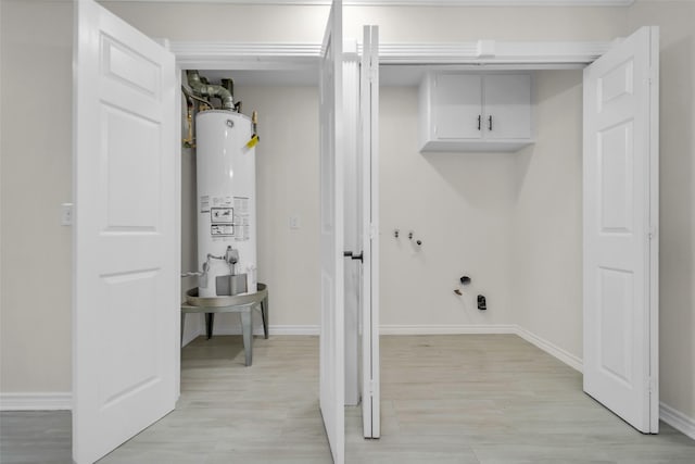 15905 Lakeview Dr, Jersey Village, TX 77040 - washroom featuring gas water heater and light wood-style floors