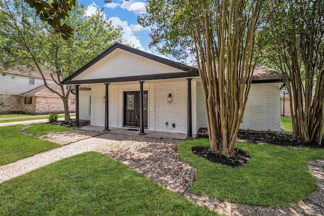 15905 Lakeview Dr, Jersey Village, TX 77040 - ranch-style house featuring a front yard, brick siding, and covered porch