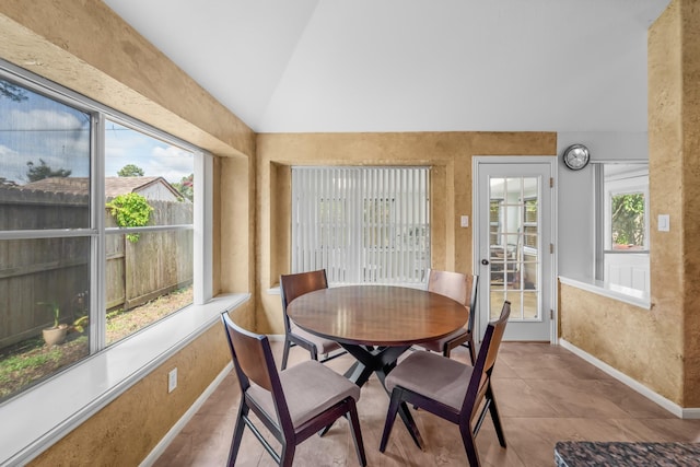 1722 Brook Grove Dr, Katy, TX 77450 - dining space featuring lofted ceiling and baseboards