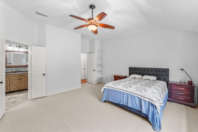 1722 Brook Grove Dr, Katy, TX 77450 - bedroom featuring light carpet, vaulted ceiling, a sink, a ceiling fan, and ensuite bath