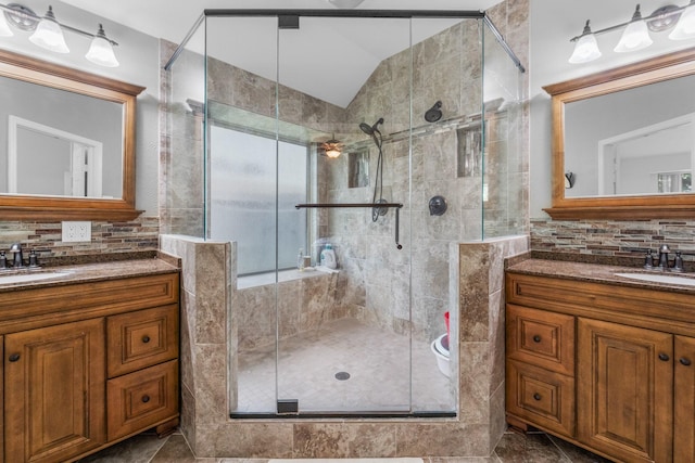 1722 Brook Grove Dr, Katy, TX 77450 - full bathroom featuring vaulted ceiling, two vanities, tasteful backsplash, and a shower stall