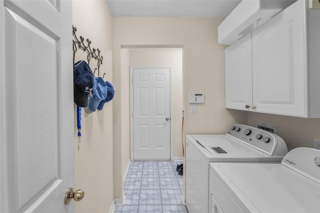 1722 Brook Grove Dr, Katy, TX 77450 - laundry area with cabinet space, washing machine and clothes dryer, baseboards, and light flooring