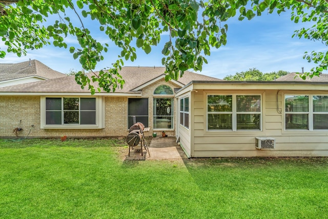 1722 Brook Grove Dr, Katy, TX 77450 - rear view of house featuring a patio, roof with shingles, a yard, and brick siding