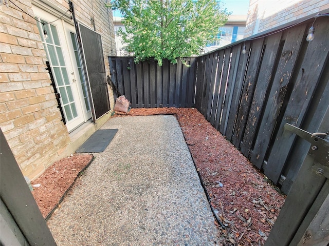 7900 Westheimer Rd Unit 255, Houston, TX 77063 - view of yard featuring a patio and french doors