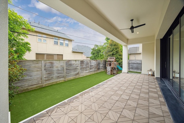 4613 Maple St, Bellaire, TX 77401 - view of patio with a playground and a ceiling fan