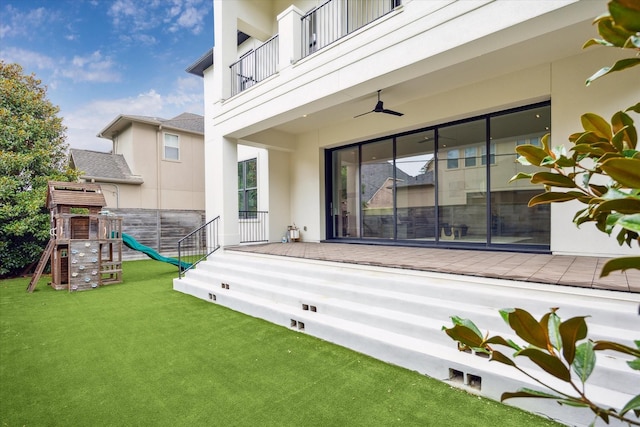 4613 Maple St, Bellaire, TX 77401 - view of patio featuring a balcony, a playground, and a ceiling fan
