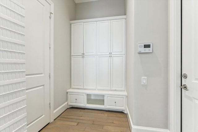 4613 Maple St, Bellaire, TX 77401 - mudroom featuring light wood-style floors and baseboards