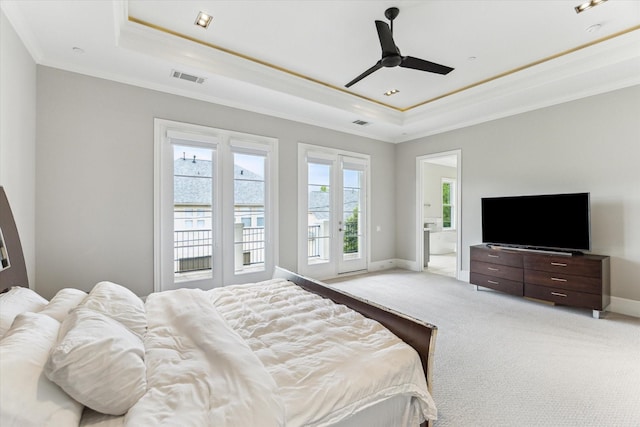 4613 Maple St, Bellaire, TX 77401 - bedroom with a raised ceiling, ornamental molding, access to exterior, light colored carpet, and baseboards