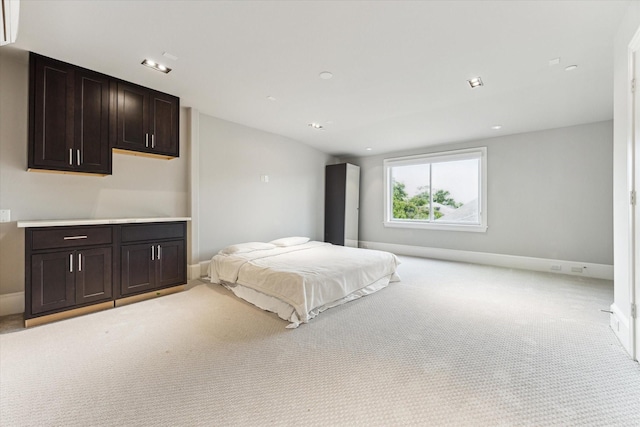 4613 Maple St, Bellaire, TX 77401 - bedroom with light colored carpet, baseboards, and an AC wall unit