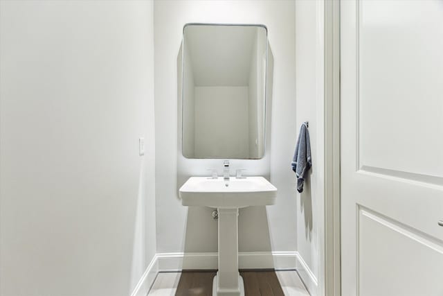 4613 Maple St, Bellaire, TX 77401 - bathroom with wood finished floors and baseboards