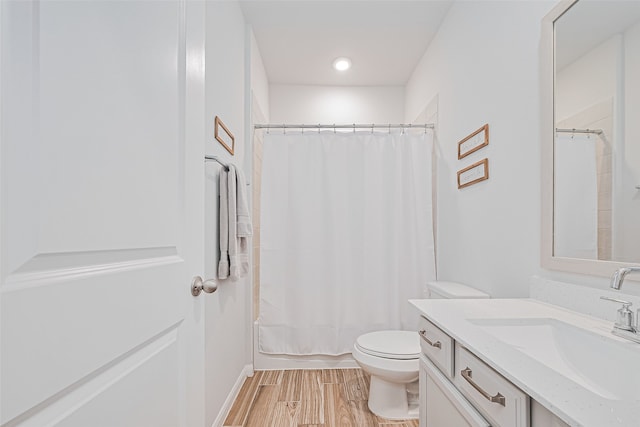 19443 Pacers Gait Ln, Tomball, TX 77377 - bathroom featuring vanity, toilet, wood finished floors, and shower / bath combination with curtain