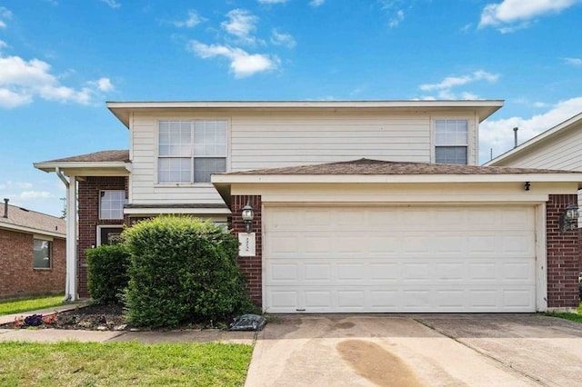 24235 Stargazer Pt, Spring, TX 77373 - traditional-style house with brick siding, concrete driveway, and an attached garage