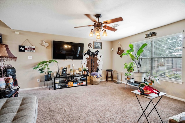 24235 Stargazer Pt, Spring, TX 77373 - living room with carpet floors, a ceiling fan, and baseboards