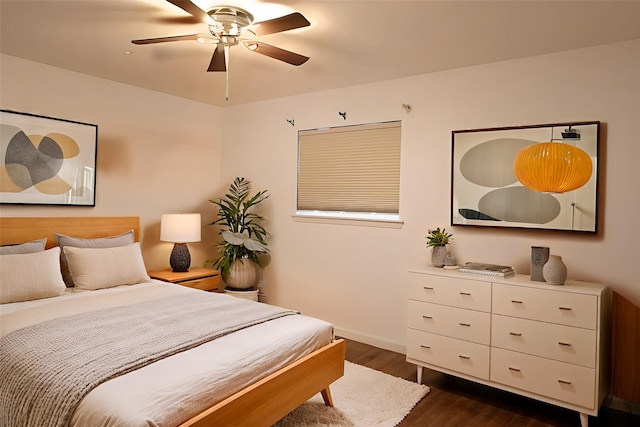 1704 Cherry Orchard Dr, Austin, TX 78745 - bedroom with dark wood-style flooring, baseboards, and a ceiling fan