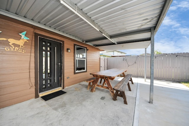 8707 Tartan Walk Ln, Houston, TX 77075 - doorway to property featuring outdoor dining area and a patio