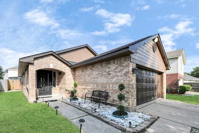 8707 Tartan Walk Ln, Houston, TX 77075 - view of front of home with brick siding, driveway, and an attached garage