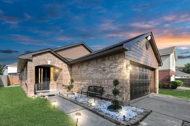 8707 Tartan Walk Ln, Houston, TX 77075 - view of front facade with brick siding, driveway, and a garage
