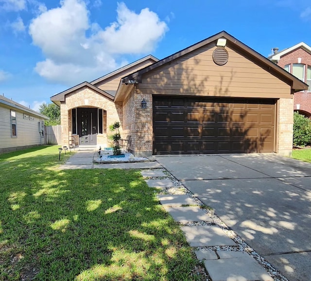 8707 Tartan Walk Ln, Houston, TX 77075 - view of front of home with an attached garage, brick siding, and driveway