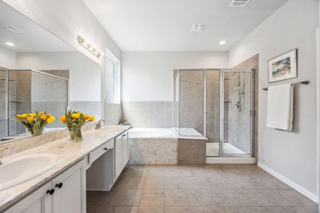 15210 Monal Trie Dr, Humble, TX 77346 - bathroom with a bath, double vanity, a shower stall, and tile patterned floors