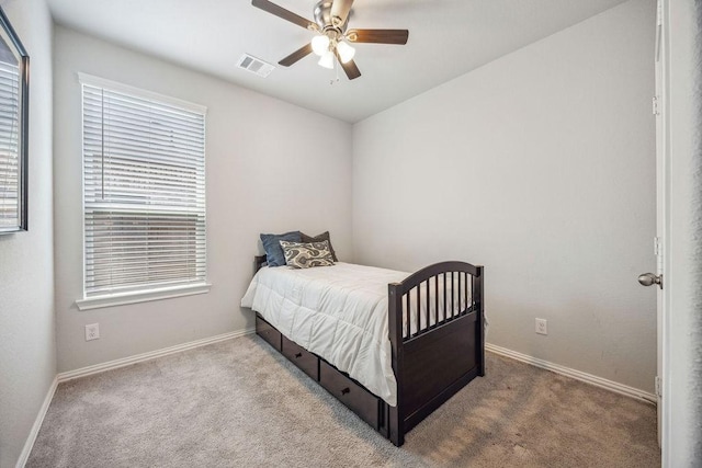 15210 Monal Trie Dr, Humble, TX 77346 - bedroom with carpet floors, baseboards, and ceiling fan