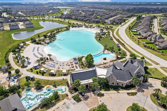 15210 Monal Trie Dr, Humble, TX 77346 - aerial view of property and surrounding area with a pool, a large body of water, and nearby suburban area