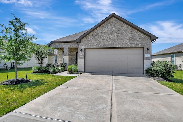 25919 Llano Knoll Ln, Katy, TX 77493 - ranch-style home featuring concrete driveway, brick siding, a front lawn, and a garage