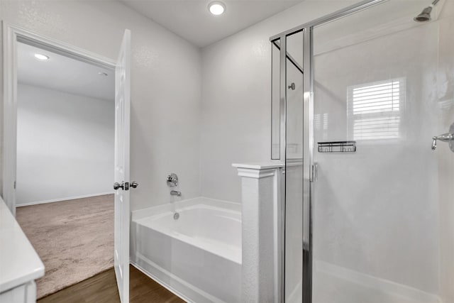 25919 Llano Knoll Ln, Katy, TX 77493 - full bath with a shower stall, a bath, wood finished floors, recessed lighting, and baseboards