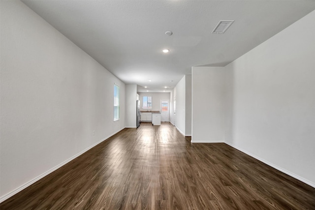 25919 Llano Knoll Ln, Katy, TX 77493 - unfurnished living room with dark wood finished floors, baseboards, and recessed lighting