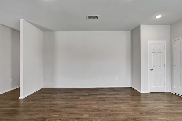 25919 Llano Knoll Ln, Katy, TX 77493 - empty room featuring dark wood-type flooring, baseboards, and recessed lighting