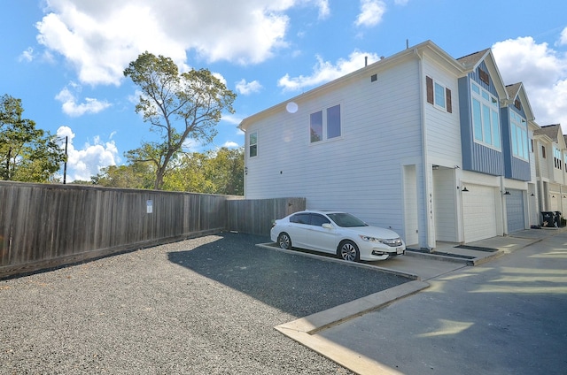 9414 Kerrwood Ln Unit B, Houston, TX 77080 - view of property exterior featuring an attached garage