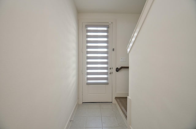 9414 Kerrwood Ln Unit B, Houston, TX 77080 - doorway with light tile patterned floors and baseboards