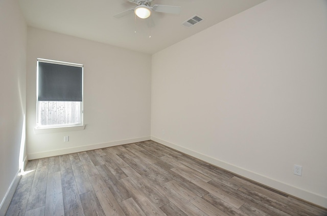 9414 Kerrwood Ln Unit B, Houston, TX 77080 - empty room featuring wood finished floors, a ceiling fan, and baseboards