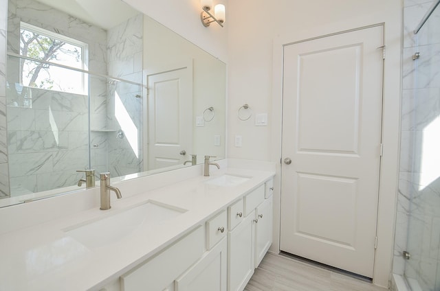 9414 Kerrwood Ln Unit B, Houston, TX 77080 - full bathroom featuring double vanity and a marble finish shower