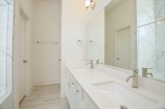 9414 Kerrwood Ln Unit B, Houston, TX 77080 - bathroom with double vanity and baseboards