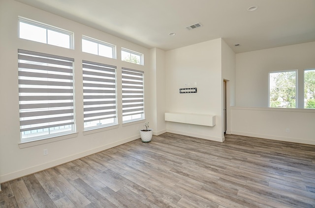 9414 Kerrwood Ln Unit B, Houston, TX 77080 - unfurnished room with plenty of natural light, wood finished floors, and baseboards