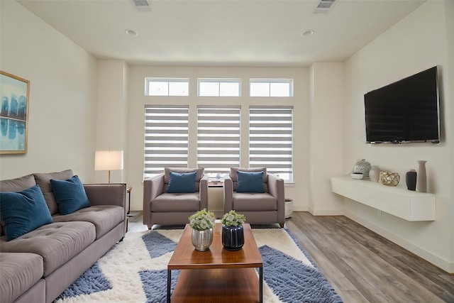 9414 Kerrwood Ln Unit B, Houston, TX 77080 - living area featuring wood finished floors, baseboards, and recessed lighting