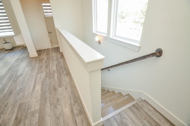 9414 Kerrwood Ln Unit B, Houston, TX 77080 - staircase with wood finished floors and baseboards