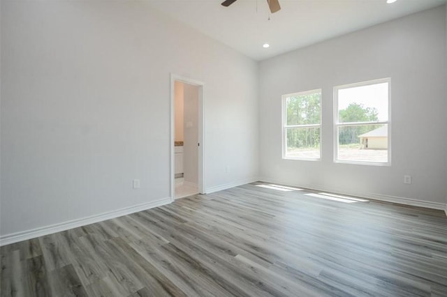 2352 Cedar Place Dr, Conroe, TX 77306 - spare room with a ceiling fan, wood finished floors, baseboards, and recessed lighting