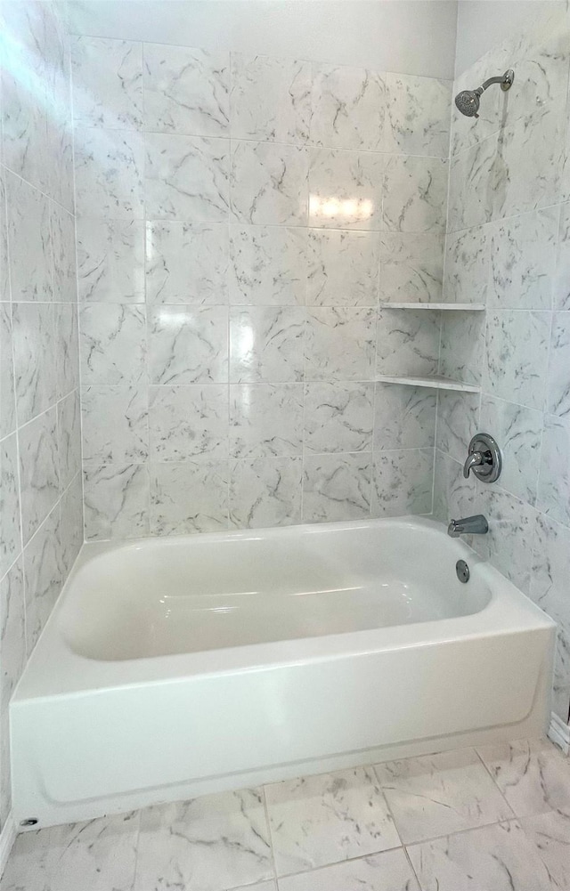 2352 Cedar Place Dr, Conroe, TX 77306 - bathroom featuring marble look tile flooring and shower / bathtub combination