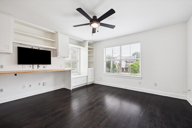 4521 Palmetto St, Bellaire, TX 77401 - unfurnished living room with plenty of natural light, dark wood finished floors, and baseboards