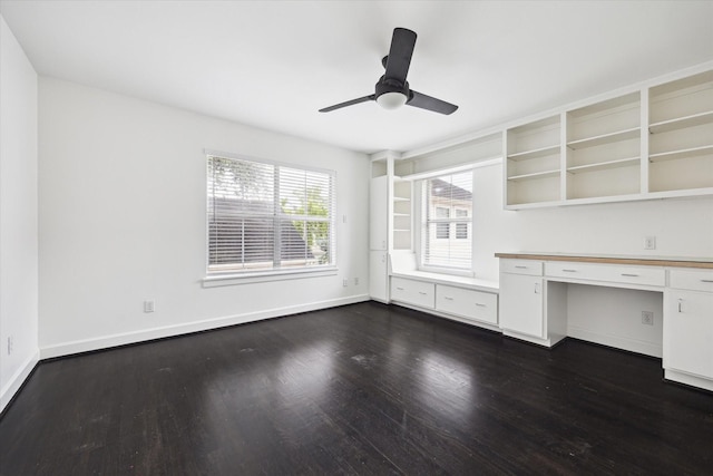 4521 Palmetto St, Bellaire, TX 77401 - unfurnished office featuring dark wood-type flooring, built in study area, a ceiling fan, and baseboards