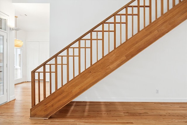 4521 Palmetto St, Bellaire, TX 77401 - staircase with wood finished floors and baseboards