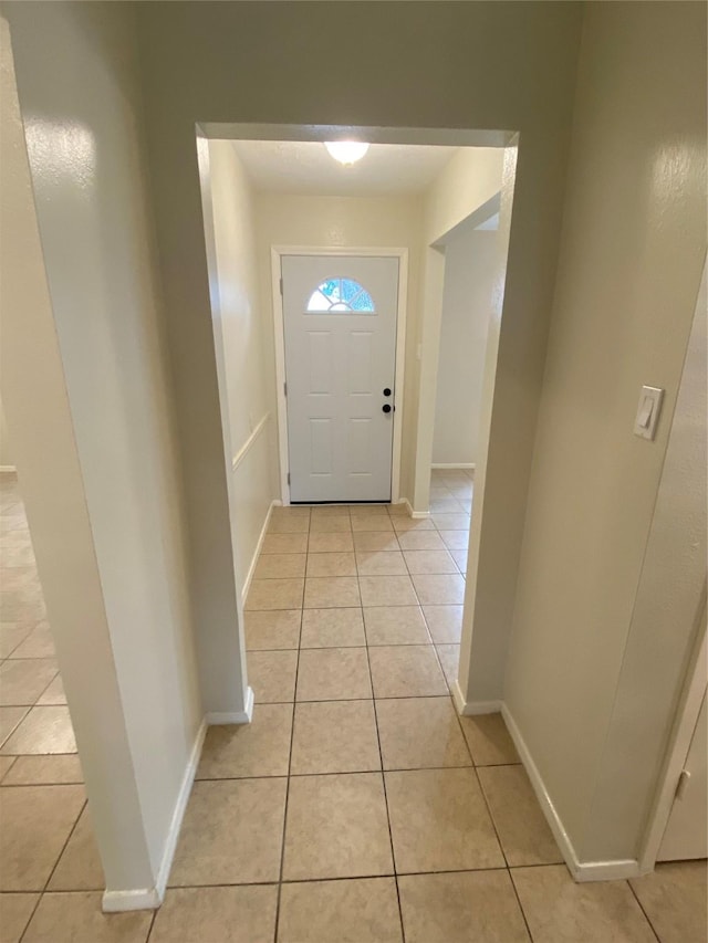 10123 Kent Towne Ln, Sugar Land, TX 77498 - doorway featuring light tile patterned flooring and baseboards