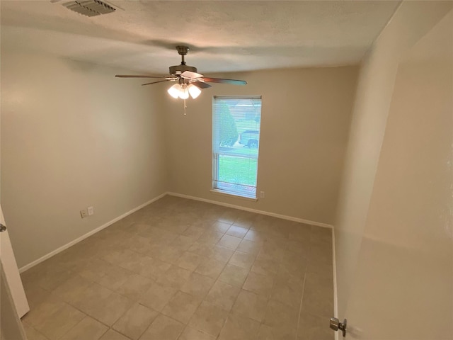 10123 Kent Towne Ln, Sugar Land, TX 77498 - spare room featuring ceiling fan, baseboards, and light tile patterned flooring