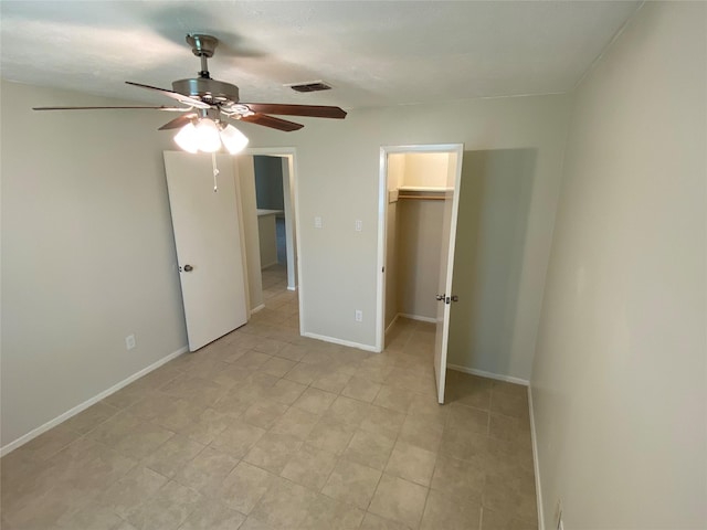 10123 Kent Towne Ln, Sugar Land, TX 77498 - unfurnished bedroom with a spacious closet, baseboards, ceiling fan, and light tile patterned flooring