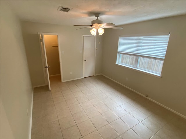10123 Kent Towne Ln, Sugar Land, TX 77498 - unfurnished bedroom featuring light tile patterned floors, baseboards, and a closet