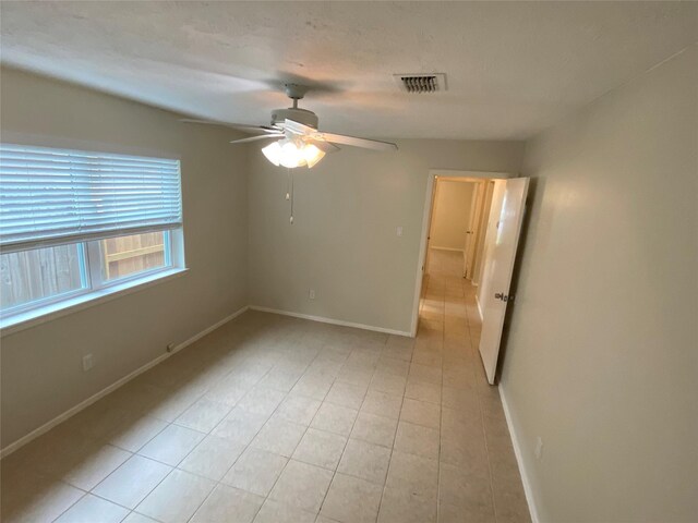 10123 Kent Towne Ln, Sugar Land, TX 77498 - spare room with a ceiling fan, baseboards, and light tile patterned floors