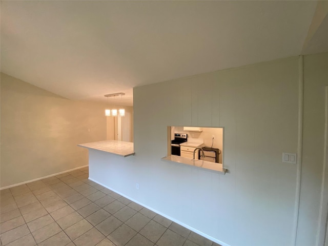 10123 Kent Towne Ln, Sugar Land, TX 77498 - empty room with baseboards, tile patterned floors, and a chandelier